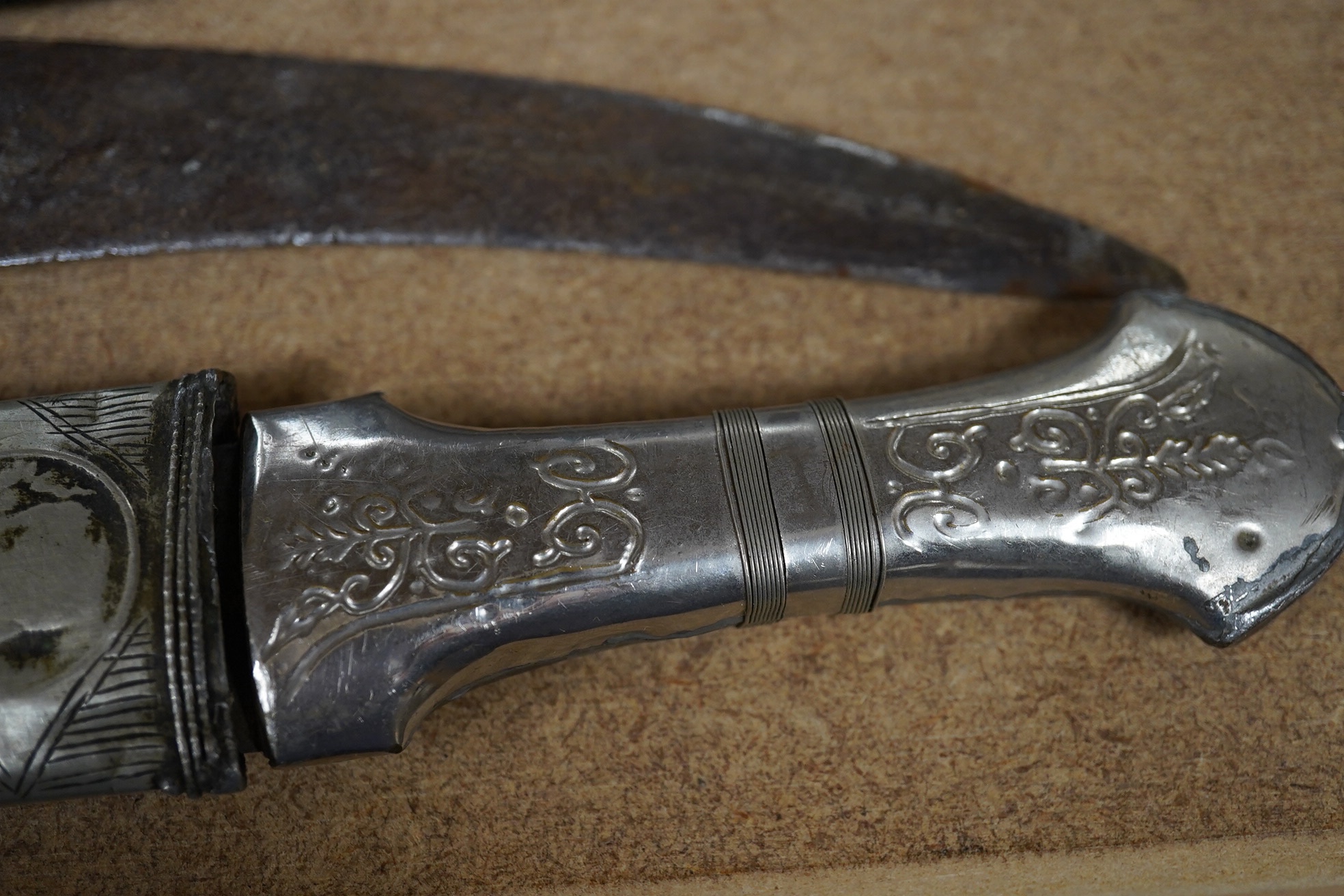 Three daggers, two with sheaths and a kukri knife, largest 33cm in length. Condition - poor